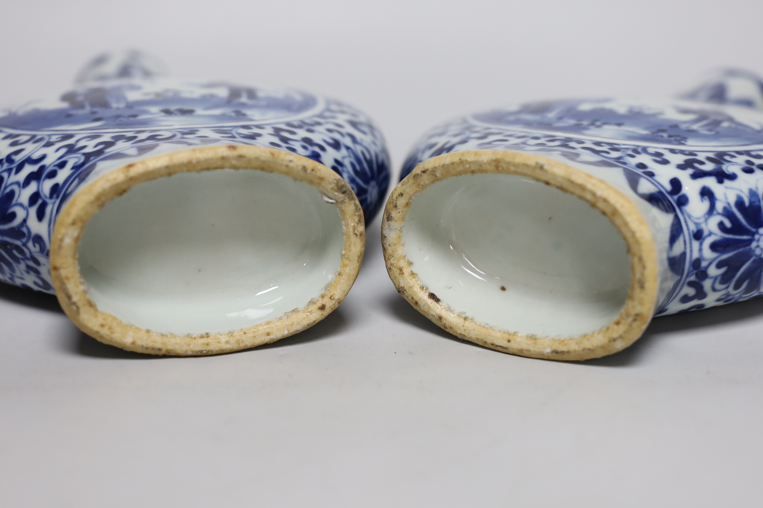 A pair of 19th century Chinese blue and white moonflasks, 26cm high